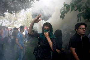 Protestor 18-Sep-09 amid swirls of teargas