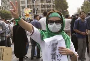 She supports Mousavi, wears a short sleeve T-shirt instead of the dark robe