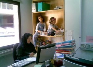 Women multi-task in offices